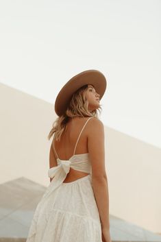 Our Seraphina Dress features an airy cotton fabric perfect for spring + summer. With embroidered eyelet detail throughout, dainty spaghetti straps and a tie back for a customizable fit. Pair it with some gold accessories and strappy sandals or wedges for an easy day or night look! Care + Measurements: 100% cotton Fully lined Hand wash cold S: approx 34.5" L (measured from shoulder to hem of skirt) Spring Sundress With Lace-up Back And Spaghetti Straps, Feminine Beach Dress With Lace-up Back, Feminine Lace-up Back Beach Dress, Summer Sundress With Delicate Straps, Spring Cotton Dresses With Delicate Straps, Summer Vacation Sundress With Delicate Straps, Spring Beach Dresses With Delicate Straps, Spring Vacation Dress With Delicate Straps, Summer Dress With Delicate Straps