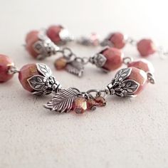 Dusty Rose Silver Floral Bracelet with Leaf and Czech Bead Cluster Dangles - Peachy Pink Beaded Jewe Peach Beaded Jewelry With Round Beads, Bohemian Peach Round Beads Jewelry, Peach Beaded Bracelet, Czech Glass Bead Bracelet, Dangle Bracelet, Floral Bracelet, Pink Beaded, Glass Beaded Bracelets, Pink Beads