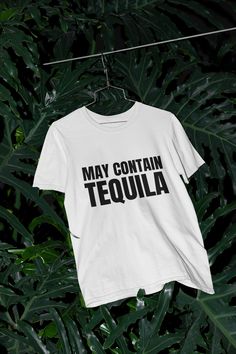 May Contain Tequila T-Shirt | Funny Shirt, Party Shirt, Alcohol, College Shirt, Gift for Tequila Lover, Trendy, Sarcastic, Unisex T-Shirt T This unisex ultra cotton tee is a classic. The shoulders are tapped for a good upper-body fit. There are no side seams, ensuring a clean, unbroken flow. The collar has ribbed knitting for improved elasticity. The materials that went into this product are sustainably sourced and economically friendly. * Medium fabric (6.0 oz/yd² (203 g/m²)) * Classic fit * Ru Fitted Fun T-shirt With Text Print, Cinco De Mayo Screen Print Crew Neck T-shirt, Novelty Crew Neck Top With Screen Print, Novelty Crew Neck Shirt With Screen Print, Novelty Graphic Print Shirt With Crew Neck, Novelty Tops With Funny Print And Crew Neck, Fitted Funny T-shirt With Screen Print, Fun Fitted T-shirt With Text Print, Fitted White Shirt With Funny Text