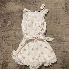 Simple’s Large Women’s White And Orange Flower Dress Cute White Floral Dress For Garden Party, Cute White Floral Mini Dress, Cute White Floral Dress With Ruffles, Cute White Floral Dress For Brunch, Cute White Floral Dress For Day Out, White Floral Dress With Ruffles For Summer, White Flower Shaped Summer Dress, White Sleeveless Floral Dress With Ruffles, Cute Off-white Spring Dress