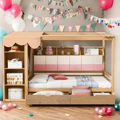 a child's bedroom with a bunk bed and storage space underneath the bed is decorated with balloons