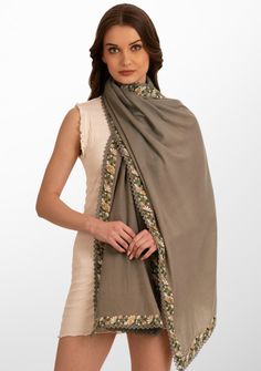 This classic natural scarf is woven from a luxurios wool and silk blend. It features a striking multi-color embroidery appliquŽ border that is further enveloped with a fine natural lace detailing. The embroidery adds a touch of sophistication whilst the exquisite lace detailing makes this scarf a must-have accessory for the fashion-forward individual. Wrap yourself in style and make a bold fashion statement with this versatile scarf that seamlessly blends warmth with artistic flair. Elegant Shawl With Embroidered Border, Elegant Multicolor Embroidered Pashmina Shawl, Elegant Pashmina Shawl With Embroidered Border, Elegant Shawl With Embroidered Border In Traditional Drape, Elegant Multicolor Embroidered Dupatta, Elegant Festive Scarves With Embroidered Border, Elegant Multicolor Embroidered Dupatta Shawl, Elegant Multicolor Embroidered Shawl Dupatta, Elegant Embroidered Shawl Fabric