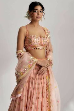 This lehenga set is perfect for a glamorous wedding ceremony, as it exudes elegance and grace. The vibrant colors and shimmering sequins make it a statement piece that will surely turn heads and leave a lasting impression. Be prepared to steal the spotlight and make a memorable entrance in the ruah gathered lehenga set. Its beautiful craftsmanship, intricate details and vibrant colors will make you feel like a queen on your special day. Anarkali Style Pre-draped Saree With Sequins For Wedding, Wedding Sharara With Sequins, Traditional Drape Lehenga With Sequins For Festive Occasions, Party Wear Chinon Choli For Festive Occasions, Semi-stitched Party Wear Choli For Festive Occasions, Designer Sequin Georgette Sets, Festive Sequined Lehenga With Traditional Drape, Wedding Party Wear Pre-draped Saree For Diwali, Festive Sequined Traditional Lehenga