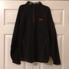 Under Armour Long Sleeve Black Lightweight Half-Zip Fleece Jacket With Red Trim. Under Armour Logo Across Back. Zip Pocket On Sleeve. Approx 28 Inches Long And Approx 24 Inches From Armpit To Armpit. Very Soft. Never Worn Nwot Black Half-zip Hiking Outerwear, Black Half-zip Outerwear For Hiking, Black Half-zip Fleece Jacket, Functional Long Sleeve Fleece Jacket For Fall, Black Long Sleeve Track Jacket For Cold Weather, Functional Long Sleeve Fleece Jacket, Fall Track Jacket For Outdoor Activities, Black Fleece Jacket With Zipper Closure, Black Long Sleeve Fleece Jacket With Zipper