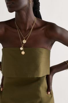 Foundrae's pieces are centered around symbols that connote strength and wellness. This 18-karat gold necklace is strung with two charms - the diamond-encrusted 'Mind Body Soul' pendant represents generations of powerful women, while the enameled 'Wholeness' one is bordered by an ouroboros to signify rejuvenation. Elegant Gold-tone Charm Necklaces, Elegant 14k Yellow Gold Coin Necklace, Luxury Gold Plated Pendant Charm Necklaces, Luxury Gold-tone Round Pendant Jewelry, Luxury Gold Chain Necklace With Pearl Charm, Elegant Pendant Coin Necklace With Charms, Luxury Gold-tone Pendant Necklace, Luxury Clavicle Chain Charm Necklace, Luxury Pearl Pendant Chain Necklace