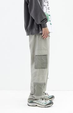 The Shadow Baggy Cargo Pants from PacSun offer a relaxed fit with wide legs, crafted from a durable cotton-nylon blend. Featuring a drawstring waistline, reinforced seams, side entry pockets, and cargo pockets with zipper details, these pants seamlessly blend practicality with contemporary style.


	Drawstring waistline
	Side pockets
	Welt back pockets
	Relaxed fit
	Cargo pockets with zip detail
	30" Inseam
	19.5" Leg opening
	Rigid
	66% Cotton, 34% nylon
	Machine washable
	Measurements taken from a size medium
	Model is wearing size medium
	Model Measurements: 6'2” Height, 30” Waist, 32” Inseam Cotton Drawstring Full-length Pants, Full Length Cotton Pants With Drawstring, Urban Wide Leg Parachute Pants With Patch Pockets, Urban Wide-leg Parachute Pants With Patch Pockets, Relaxed Fit Cargo Jeans With Elastic Waistband For Outdoor, Streetwear Full-length Parachute Pants With Patch Pockets, Streetwear Full Length Parachute Pants With Patch Pockets, Techwear Full Length Cotton Cargo Pants, Casual Cargo Pants With Drawstring And Loose Fit