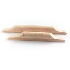 two wooden spoons sitting on top of each other