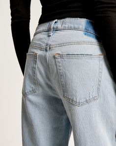 Our classic low rise baggy jeans in a light wash, with knee blowout details and a clean hem. This fit features a 8.5” low rise, is slightly relaxed at waist and hips, and eases at the thigh into a baggy, full-length leg shape. We recommend buying your true size for a baggier fit. Size down for a closer fit. This jean is made from our vintage stretch fabric which features both an authentic vintage look and contains slight built-in stretch for additional comfort. Low Rise Baggy Jeans, Baggy Jean, Women's Bottoms, Chic Top, Modern Wardrobe, Jeans Light, Low Rise Jeans, Pocket Bag, Baggy Jeans