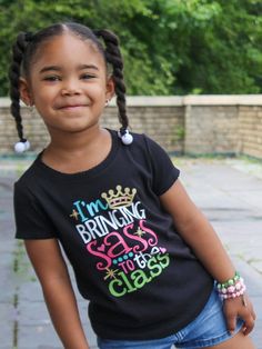 Bring sass to the class this year in our adorable back to school t-shirt! We make back to school shopping fun and easy! Create a fun and stylish wardrobe for your little one! We're sure your daughter's teacher will get a kick out of this one! Materials 100% cotton short sleeve length, black girls style + unisex available heat transfer vinyl design printed in Philadelphia, PA Returns & Exchanges If you need to return your item(s) for whatever reason, please contact us at info@mmofphilly.com withi Short Sleeve T-shirt For School Events In Summer, Black T-shirt For Back To School Events, Cute Crew Neck Tops For School Events, Playful T-shirt For School In Spring, Cute Letter Print Tops For School Events, Cute Graphic Print Tops For School Events, Black Casual Tops For School Events, Casual Black Tops For School Events, Fun Short Sleeve T-shirt For School