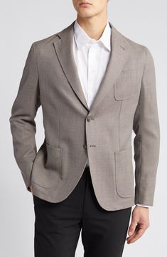 Tailored from subtly textured wool, this sport coat features softer construction that makes it a perfect choice for relaxing any semiformal look. 28 1/2" length (size 46EU) Notched lapels Chest patch pocket; front patch pockets Partially lined 100% virgin wool Dry clean Imported