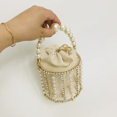 Product Information: Material: alloy pearl rhinestones Fabric texture: velvet Style: Women's handbag Bag shape: bucket type Trendy Bags Style: Bucket Bag Opening method: withdrawing Popular elements: pearls Bag internal structure: mobile phone bag Strap root number: single Bag size: small Pattern: plain Hardness: hard Packing list: Bucket bag*1 Elegant Rhinestone Bucket Bag, Elegant Bucket Bag With Rhinestones, Glamorous Evening Bucket Bag, Glamorous Bucket Evening Bag For Events, Chic Bucket Evening Bag For Party, Chic Party Bucket Evening Bag, Elegant Handheld Bucket Bag For Parties, Luxury Handheld Bucket Bag For Party, Evening Bucket Bag With Rhinestones