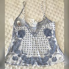 In Bloom Womens Size M Spaghetti Strap Tank/Cami Size: M Measurements Flat Across: Bust Across: 18” Length: 26” Fabric Content: 100% Rayon Summer V-neck Tops With Crochet Lace, Lace V-neck Camisole For Vacation, White Printed Camisole Top, Lace V-neck Camisole For Summer, Summer Lace Tank Camisole, Lace Tank Camisole For Summer, Fitted Lace Camisole Casual Style, Casual V-neck Camisole With Lace Trim, Casual V-neck Lace Tank Top