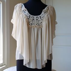 Lace Peasant Top With Butterfly Sleeves. Size Small, Ivory In Color. New Without Tags, Never Worn. Cream Bohemian Blouse For Vacation, Bohemian Cream Blouse For Vacation, Flowy Cream Blouse For Beach, Flowy Cream Blouse For The Beach, Cream Blouse With Crochet Trim For Beach, Cream Bohemian Peasant Top, Beige Peasant Top For Vacation, Flowy Bohemian Cream Blouse, Beige Bohemian Blouse With Crochet Trim