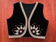 This is a adorable embroidery women's vest . You can match this beautiful vest with anything, including pants, shirts or skirts. This embroidery vest looks great for any occasion (culture festivals , school ,Nowruz , yalda night ,performance or just for your special occasions ). Can be ordered in size 3 years old to 12 years old girls . Adult sizes are XS , S , M , L , XL , XXL .If you have any questions about sizing feel free to contact me and I will help you for choosing the best size . You ca Luxury Festive Embroidered Vest, Elegant Embroidered Sleeveless Vest, Fitted Vest With Floral Embroidery For Festive Season, Festive Fitted Vest With Floral Embroidery, Festive Embroidered Fitted Vest, Festive Fitted Embroidered Vest, Traditional Black Sleeveless Vest, Festive Fitted Vest With Intricate Embroidery, Elegant Embroidered Festive Vest