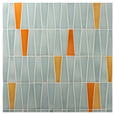 an orange and white tiled wall with geometric shapes