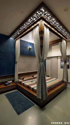 a bed room with a neatly made bed and curtains