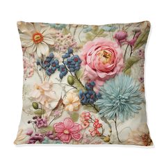 a decorative pillow with flowers and leaves on the front, in pastel colors is shown