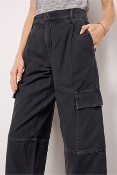 Add the Jericho Pant by AGOLDE to your utility collection. Crafted in a comfortable cotton canvas material, these pants feature a high-rise fit, four-pocket styling, pleats at the front, and cargo pockets on the outseams. Style these with your favorite graphic tee, sneakers, and baseball cap for an effortlessly chic look. Cotton Cargo Jeans With Pockets For Workwear, Cotton Workwear Cargo Jeans, Utility Style Wide Leg Washed Black Pants, Washed Black Wide Leg Utility Pants, Utility Style Relaxed Fit Chinos With Belt Loops, Washed Black Wide Leg Cargo Pants With Relaxed Fit, High Waist Washed Black Cargo Pants With Pockets, Washed Black Relaxed Fit Wide Leg Cargo Pants, Cotton Cargo Jeans With Multiple Pockets For Work