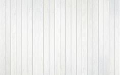 white wood paneling with vertical lines on the wall and floor in an empty room