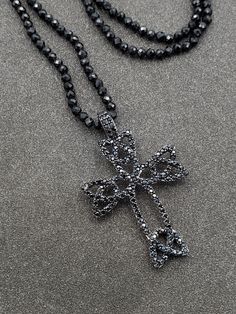 Wonderful, 925 Sterling Silver Black Spinel Gothic Style Celtic Cross Pendant with Beaded Necklace.  This beautiful necklace is sure to receive many compliments!  SOLID 925 STERLING SILVER, FULLY TESTED, NOT PLATED OR FILLED.  Length: 23.5"  Width: 2.4mm  Gemstone: Black Spinel  Weight: 10.1 Grams  Hallmarked: 9258 / CN / FZN  We gladly combine shipping!  Everything is packed with care to make sure it arrives safely.  We only sell authentic items. If it is a name brand item, we guarantee it to be authentic.  If it is made of precious metals and or gemstones, we guarantee it to be as described.  Please check our feedback and buy with confidence.  We work very hard to make sure you are happy doing business with us, and we appreciate your positive feedback very much!  Please email us with any Silver Cross Jewelry With Black Beads, Celtic Cross, Black Spinel, Gothic Style, Beautiful Necklace, Gothic Fashion, Solid 925 Sterling Silver, Positive Feedback, Cross Pendant