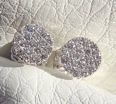 "You will LOVE these little stud earrings. They are classic and chic. They are very petite style earring. The entire earring is 7mm wide in diameter. The diamonds color is beautiful and rich. The earrings are made in 18k white gold. They are 7 mm wide. The posts are 10 mm long. The diamonds total carat weight is aprox. .40cts The friction backs are 14k white gold. The clarity of the diamonds is VS and color G range. The color combination of the bright white of the 18k white gold settings against White Platinum Hallmarked Earrings, Platinum Hallmarked Anniversary Earrings, Platinum Hallmarked Earrings For Anniversary, Formal Vvs Clarity Diamond Cluster Earrings, Formal White Gold Cluster Earrings Hallmarked, Formal Round Platinum Cluster Earrings, Luxury Diamond Cut Cluster Earrings, Luxury Diamond White Cluster Earrings For Anniversary, Luxury Cluster Diamond Earrings For Anniversary