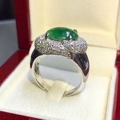 TOP NATURAL BURMESE JADE RING! RARE GREEN QUALITY. DARK GREEN COLOR, AMAZING SHADE OF GREEN, AND EVERLASTING, UNIQUE BURMESE JADE GLOW! WEALTHY!! FOR VIDEO: http://www.youtube.com/watch?v=XpbbgwhH50o IN CASE OF RETURN FOR US BUYERS. BUYERS MAY SEND THE ITEMS BACK TO OUR US-BASED OFFICE IN SALT LAKE CITY, UTAH CUSTOMARY, HANDCRAFTED 18K SOLID WHITE GOLD RING! ONE OF A KIND ITEM! WHAT YOU SEE IN THE PICTURES IS WHAT YOU WILL GET! SUGGESTED RETAIL VALUE: $14,500 JADE Weight: 4.53 cts. Dimensions: 1 Luxury White Gold Oval Cabochon Emerald Ring, Formal White Gold Emerald Ring With Oval Cabochon, Luxury Tsavorite Emerald Ring, Oval Tsavorite Diamond Ring For Formal Occasions, Burmese Jade, Golden South Sea Pearls, Dark Green Color, Jade Ring, White Gold Engagement Rings