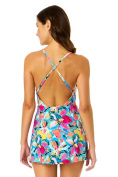 You'll love how confident you feel in our Swim Dress With Skirted Bottom. This one piece swim dress is designed with a colorful floral design making you the center of attention everywhere you go. With its skirted swim bottom, you can enjoy the beach in comfort whether you're relaxing by the pool or enjoying the water. Adjustable back straps and removable cups provide customizable support and a secure fit. Complete your look by pairing it with any Anne Cole cover up! Beach Swim Dress With Built-in Liner And Stretch, Stretch Swim Dress With Built-in Liner For Beach, Multicolor Tankini With Built-in Bra For Beach, Spring Vacation Swim Dress With Built-in Bra, Beachwear Dress With Built-in Bra For Pool, Multicolor Tankini With Built-in Bra For Swimming, Tropical Multicolor Swimwear With Built-in Bra, Summer Tropical Print Swim Dress For Poolside, Summer Swim Dress With Tropical Print For Poolside