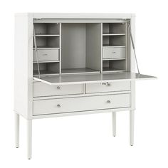 a white desk with drawers and shelves on it