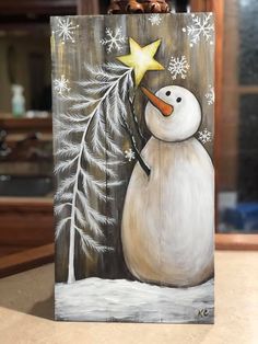 a painting of a snowman with a star on his nose, and pine cones in the background