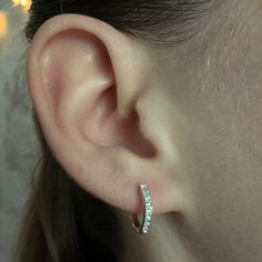 Our Hoop Earrings. Crafted with sterling silver, our silver hoop earrings feature cubic zirconia stones for that extra sparkle. These are a staple piece, and an easy everyday option! ✦Metal: 925 Sterling Silver ✦Plating: Rhodium ✦Size: 12mm x 2mm ✦Latch Back ✦Nickel Free ➳We guarantee our jewelry is highly durable & long lasting! ♡ ➳$1 Shipping On All Orders or FREE SHIPPING when you spend $35 or more at our shop! ♡ ➳USPS Ground Advantage 2-5 Day Shipping! ♡ ➳All packages insured up to $100! ♡ ➳ Small Hoop Silver Diamond Earrings For Pierced Ears, Hypoallergenic Small Hoop Diamond Earrings In Sterling Silver, Small Hoop Sterling Silver Earrings In Diamond White, Sterling Silver Sparkling Stones Huggie Earrings, Sterling Silver Huggie Earrings With Sparkling Stones, Sparkling Stones Hoop Earrings, Hypoallergenic Sterling Silver Hoop Diamond Earrings, Sterling Silver Small Hoop Diamond Earrings, Hypoallergenic Sterling Silver Diamond Hoop Earrings