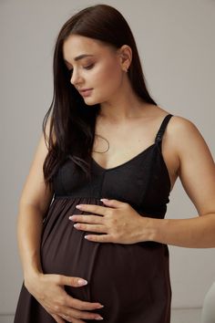 Introducing our fabulous Nightwear for Nursing, a must-have for expecting and breastfeeding mothers! This cotton nightgown is specially designed to provide ultimate comfort, while also keeping you stylishly on-trend. Whether you prefer a touch of lace on the cup or a more simplistic look, we've got you covered. Not only does our nighty offer incredible support for your precious assets, but it also features a sewn-in bodice that ensures optimal breast support. Say goodbye to discomfort and hello to convenience with our convenient clip for easy feeding access. Our Nighty for Nursing is the perfect blend of maternity lingerie and homewear, making it an essential addition to your wardrobe. From its comfortable fit to its functional design, every detail has been carefully crafted with your need Bump Friendly Nursing Bra For Loungewear, Maternity Nursing Bra, Black Bump Friendly Maternity Dress, Black Bump-friendly Maternity Dress, Black Nursing-friendly Maternity Dress, Black Nursing Friendly Maternity Dress, Dress For Pregnant, Maternity Nightwear, Pregnant Dress