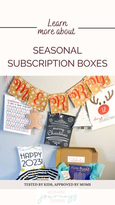 a box filled with christmas cards and other holiday items on top of a white wall