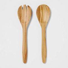 two wooden utensils on a white background one has a fork and the other has a spoon