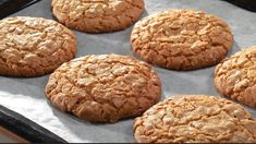 six cookies sitting on top of a baking sheet