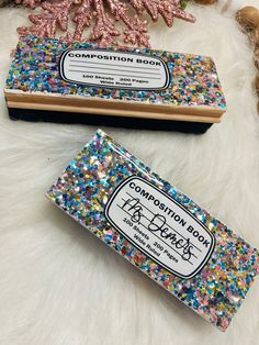 two soap bars sitting on top of a white fur covered floor