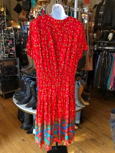 "Boho Red Rayon Dress with Attached Vest, Caroline Wells II Dress, Women's 18 Measurements 18\" Shoulder 50\" Bust 36\" to 44\" Elastic Waist 50\" Length in Back In good used condition." Vintage Red Midi Dress With Floral Print, Red Floral Print Maxi Dress With Short Sleeves, Red Floral Print Short Sleeve Maxi Dress, Red Rayon Summer Dress, Red V-neck Midi Dress With Vibrant Print, Red Floral Print Maxi Dress For Daywear, Red Rayon Beach Dress, Fitted Red Midi Dress With Vibrant Print, Red Fitted Bohemian Dress