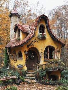 a small yellow and brown house in the woods