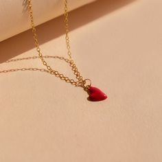 Let your big heart be showcased with our dainty Red Heart Necklace. The cherry red heart charm is minimalist and perfect for layering with any other chains in your collection. This charm necklace is a trendy yet everyday design to throw on and add brightness to a simple outfit. Material: High Quality Solid 925 Sterling Silver Finish: Sterling Silver ∙ 18K Gold Featuring a ~8 x 6mm Red Enamel Heart Charm with minimalist cable chain adjustable 16 inches to 18 inches SKU: RR-NR141 Trendy Heart Charm Necklace With Delicate Chain, Trendy Heart Necklace With Heart Charm For Gifting, Trendy Heart-shaped Charm Necklace With Delicate Chain, Trendy Heart Necklace With Heart Charm As Gift, Trendy Heart Charm Necklace As A Gift, Trendy Red Heart Beads Necklace, Trendy Red Jewelry With Heart Beads, Trendy Heart Print Jewelry For Gifts, Trendy Heart Pendant Jewelry With Heart Print