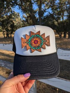 One-of-a-kind hat, with a hand-tooled leather patch This leather patch was slowly tooled by hand, without a pattern, dyed, painted, distressed and sealed. Because of this handmade process, no two of my hats will ever be exactly the same.  You will get the exact hat in the photos.  Please see my other current hats for sale at theLeatherKnot.etsy.com. Black and white Nissin brand trucker hat, Adjustable and comfortable, One size fits most.  This is not a floppy hat style, it is structured with a h Handmade Artisan Leather Hat, Artisan Handmade Leather Hat, Leather Bohemian Hats For Festivals, Handmade Bohemian Trucker Hat, Handmade Bohemian Adjustable Trucker Hat, Handmade Adjustable Bohemian Trucker Hat, Handmade Bohemian Snapback Hats, Patch Hat, Hat Style