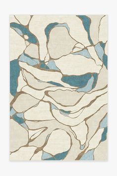 a white rug with brown and beige designs on the front, in an abstract manner