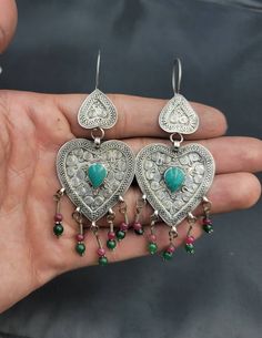 It's Totally Beautiful Handmade Authentic Silver Turkmani Earrings With Natural Turquoise Stone And Tinny Red Ruby And Green Emerald Gemstone Hanging its beautifully made its Vintage From Afghanistan Material Silver Gemstone Turquoise Ruby and Emerald Traditional Heart-shaped Jewelry For Festive Occasions, Traditional Heart-shaped Wedding Earrings, Traditional Turquoise Earrings With Latkans, Traditional Turquoise Gemstone Earrings, Traditional Turquoise Earrings With Natural Stones, Traditional Red Earrings With Natural Stones, Silver Turquoise Earrings, Natural Turquoise Stone, Red Ruby