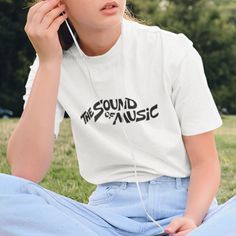 New! The Sound Of Music T-Shirt In White. Mens/Unisex Cut And Sizing For Comfortable Fit. 100% Cotton. Crew Neck. Short Sleeves. White Color Tee With Black Design. Tags # Style With Words Sayings Lyric Retro Movie Guys Mens Womens Teens Urban Outfit Casual Classic Unique Custom Bold Cool Handmade Heavyweight Essential Basic Cheap Music-themed Fan Merchandise Shirt, White Music-themed Crew Neck T-shirt, Music-themed White Tops With Letter Print, Casual T-shirt With Logo Print For Concerts, White Music-themed Top For Concerts, Casual Logo Print T-shirt For Music Festivals, Casual Band Logo T-shirt, Casual T-shirt With Logo For Music Festivals, White Music-themed Cotton Top