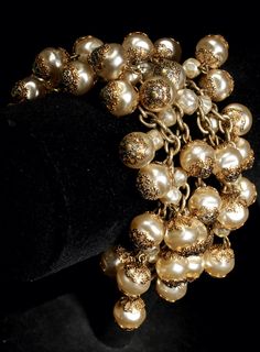 "This is a truly gorgeous vintage faux pearl bracelet. This wide golden pearl bead bracelet shimmers and moves with every turn of the wrist. Marked RM on the clasp. it closes with a gold metal loop. This bracelet is for a small wrist. Perfect for a bride and it would make a great gift. Measurements Length - 6\" Width - 1 1/2 - 4 rows of pearls Happy to answer questions about this item Please note that my store does not accept returns and does not ship internationally" Gold Metal Pearl Bracelet For Party, Gold Round Beads Evening Jewelry, Vintage Gold Beads Jewelry For Formal Events, Vintage Gold Beaded Jewelry, Vintage Formal Jewelry With Gold Beads, Formal Gold Beaded Bracelet With Pearl Charm, Formal Gold Beaded Bracelets With Pearl Charm, Gold Beaded Evening Bracelets, Gold Beaded Bracelets With Pearl Charm For Formal Occasions