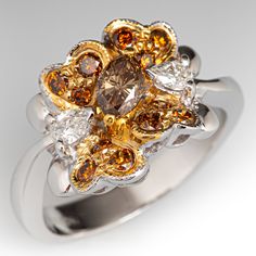 a fancy ring with yellow and white diamonds