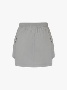 MO&Co. Women's Drawstring Detail Pocket Skirt Introducing our skirt - a must-have for any fashion-forward individual. Crafted from luxurious, comfortable fabric, this mini cargo silhouette features an elasticated waist with a drawstring for the perfect fit. The large patch pocket design adds functionality, making it a versatile piece for casual occasions. Pair with our coordinating cropped Jacket for a sophisticated, elevated look. Features : - Inclusive mini cargo silhouette- Elasticated waist with drawstring- Side large patch pocket design Code: MBD2SKT008The back length of size S is 38cmMATERIALS & CARE Material: 100% PolyamidePlease put it into a mesh bag to wash.REMINDER: All items are measured manually. Please note that it's reasonable that there might be minor measurement difference Summer Cargo Skirt With Elastic Waistband, Summer Cargo Skirt With Elastic Waistband And Relaxed Fit, Casual Solid Color Cargo Mini Skirt, Relaxed Cargo Skirt With Elastic Waistband For Summer, Spring Casual Nylon Mini Skirt, Casual Nylon Mini Skirt For Summer, Tiered Skirt Bottoms With Side Pockets For Summer, Relaxed Cargo Skirt With Pockets For Summer, Chic Mini Cargo Skirt With Side Pockets