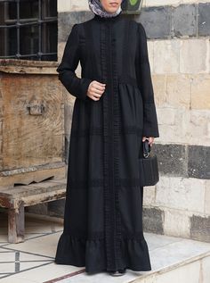 Full length Buttoned mandarin collar Hidden button placket full opening Lace detailing Ruffled trim either side of button placket and above collar Gathering below waist, hem and upper sleeves Model is 168cm (5 feet 6 inches) and wearing size M. Item Code: wD9531 Elegant Fall Abaya With Modesty Panel, Elegant Abaya With Modesty Panel For Fall, Elegant Long Sleeve Outerwear For Eid, Elegant Long Outerwear For Eid, Abaya Black, Lace Ruffle, Comfortable Dress, Different Fabrics, Mandarin Collar