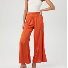 Satin Vented-Hem Wide-Leg Pants. Orange. Size M Fitted Viscose Bottoms For Loungewear, Trendy Rayon Bottoms For Loungewear, Chic Viscose Bottoms For Day Out, Trendy Rayon Bottoms With Elastic Waistband, Trendy Rayon Bottoms For Spring, Fitted Viscose Bottoms With Elastic Waistband, Chic Fitted Rayon Pants, Casual High-waisted Rayon Pants, Casual Rayon Pants For Day Out