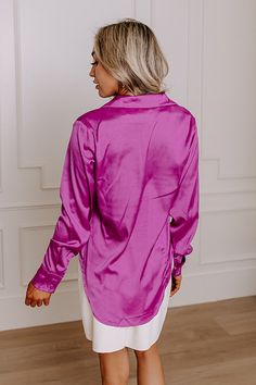 - You will love this luxe feeling pajama top! - A collared v-cut neckline - A button up front - Long sleeves with button closure cuffs - A relaxed silhouette that ends in a rounded hemline Chic Solid Blouse For Loungewear, Chic Blouse For Loungewear, Chic Solid Color Blouse For Loungewear, Solid Color Tops With Button Closure For Loungewear, Tops With Button Closure For Loungewear, Elegant Button-up Tops For Loungewear, Button Closure Top For Pajama Party In Spring, Long Sleeve Blouse For Pajama Party, Chic Purple Top With Button Cuffs