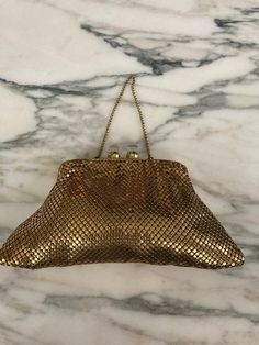 Just like Whiting and Davis but no signature this adorable Little mesh bag has Lucite closure probably from the 1950s or 60s. Has a pocket and a chain handle. Please look at photos for measurements, great for lipstick compact and a couple of other small items in very good condition.  I believe it is american made and is same quality as the Whiting and Davis purse.   As always, local pickup is available. Aphrodite's Antique & Gifts 11 Milton Ave, Highland, NY 12528 845-255-2769 Vintage Pouch Bag For Party, Vintage Handheld Bag For Party, Vintage Gold Pouch Bag, Vintage Gold Pouch Shoulder Bag, Vintage Satchel Shoulder Bag For Party, Vintage Evening Coin Purse Pouch, Vintage Satchel Evening Bag For Parties, Retro Clutch For Vintage Events, Retro Rectangular Coin Purse For Evening