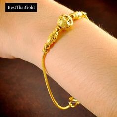 This Shop has a Special Free Gift (Chain) for Every Order. 😊🙏 Item: 1 x Bracelet For: Women Type: GOLD PLATED over Brass, Nickel free Gold Purity: 96.5% Surface: Sand matted Length: ~ 6.5-7 inches length Color: Yellow Gold (slightly +/- from photo) Handmade from Thailand. Thai gold plating technic really solid and stunning look. Rewarding your life from hard working, match up your dress, bridesmaid wedding engagement or a gift to someone special for you. The Craftsmanship of Thai Jewelry 💍💎 Gold Plated Bracelets With Gold Beads For Gift, Gold-plated Bracelets With Gold Beads For Gift, Gold Jubilee Bracelet For Wedding, Gold Charm Bracelet For Anniversary, Yellow Gold Bracelet With Gold Beads For Wedding, Gold Bangle Charm Bracelet For Anniversary, Gold Bangle Charm Bracelet For Wedding, Yellow Gold Plated Chain Bracelet With Gold Beads, Gold Round Chain Bracelet For Wedding